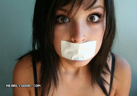 cutebabewithtapeonhermouth.jpg