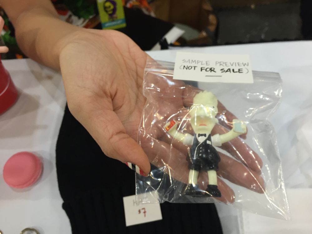 Agent Wednesday holds a One Dollar Man figure that will be released in February. (Photo: Liz Ohanesian)